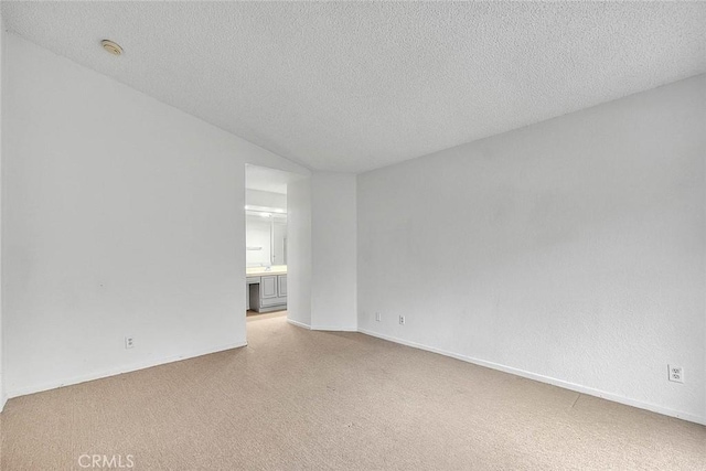 1207 Porto Grande Unit 1, Diamond Bar, CA 91765 - spare room with carpet, a textured ceiling, and baseboards