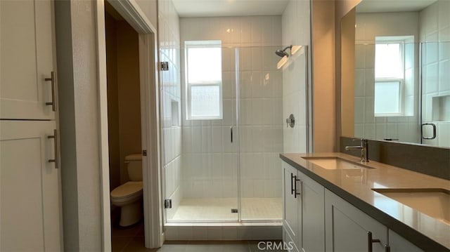 2296 Synergy, Irvine, CA 92614 - full bath featuring toilet, a shower stall, double vanity, and tile patterned floors