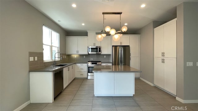 2296 Synergy, Irvine, CA 92614 - kitchen featuring appliances with stainless steel finishes, a sink, decorative backsplash, light tile patterned floors, and recessed lighting