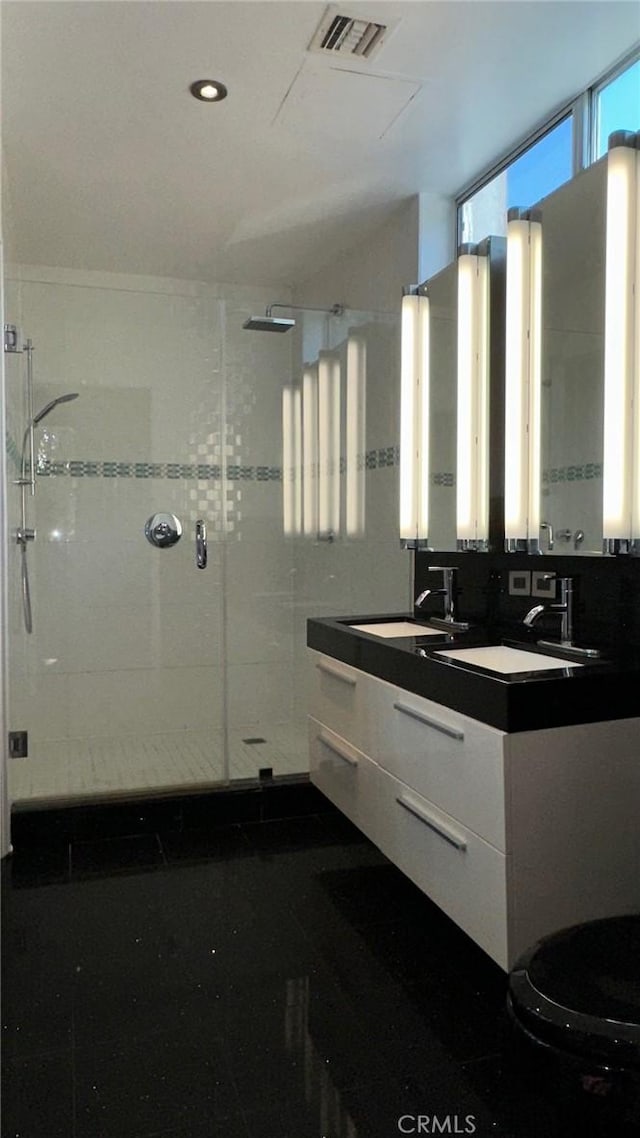 1419 Angelus Ave, Los Angeles, CA 90026 - bathroom featuring a shower stall, double vanity, toilet, and recessed lighting