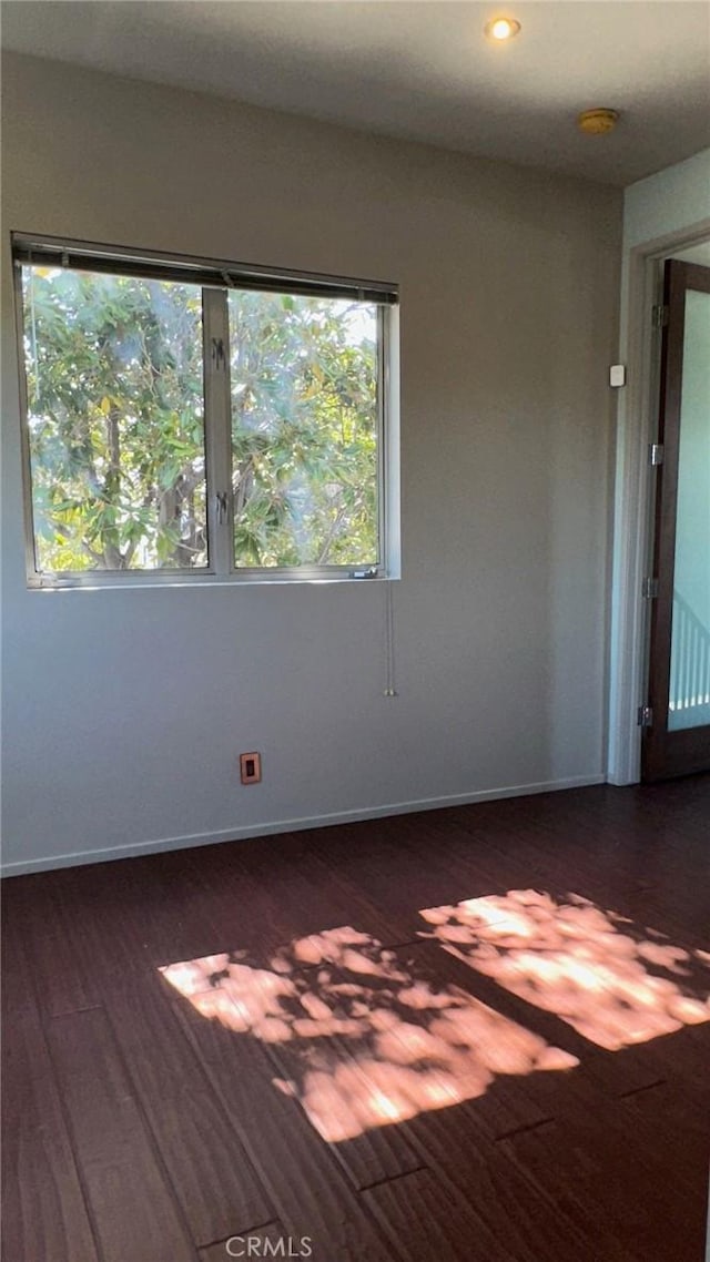 1419 Angelus Ave, Los Angeles, CA 90026 - unfurnished room with healthy amount of natural light, dark wood-type flooring, recessed lighting, and baseboards