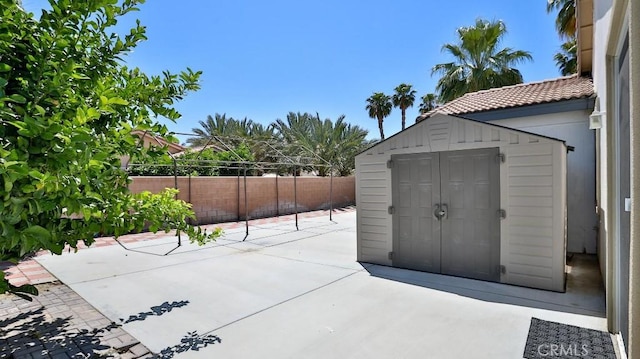 view of shed with a fenced backyard