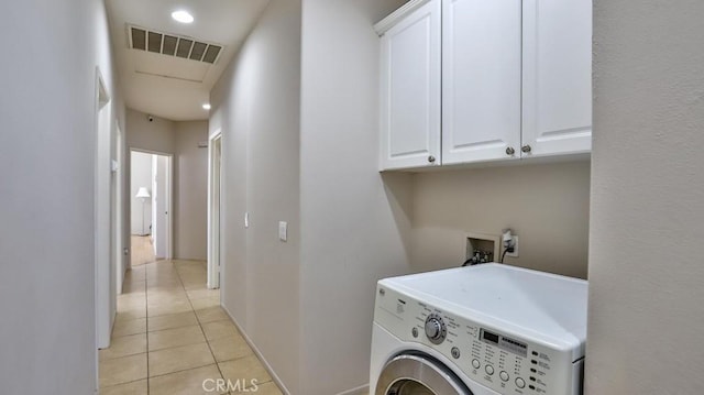 laundry room with washer / clothes dryer, light tile patterned floors, and cabinet space