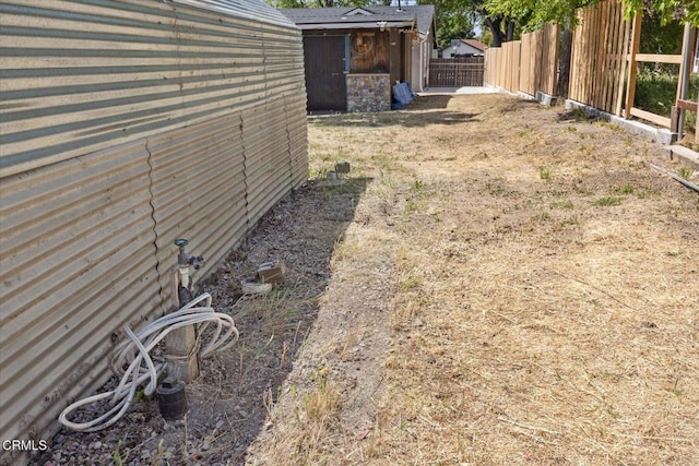 8730 Junipero Ave, Atascadero, CA 93422 - view of yard with fence, an outbuilding, and a storage unit