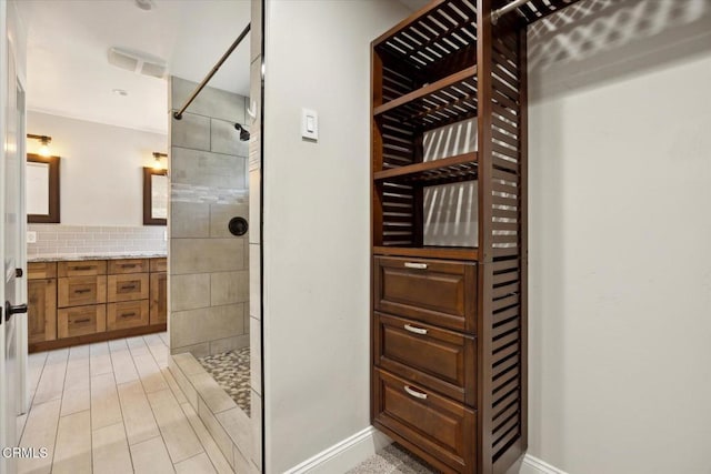 8730 Junipero Ave, Atascadero, CA 93422 - full bathroom with a walk in shower, vanity, and tasteful backsplash