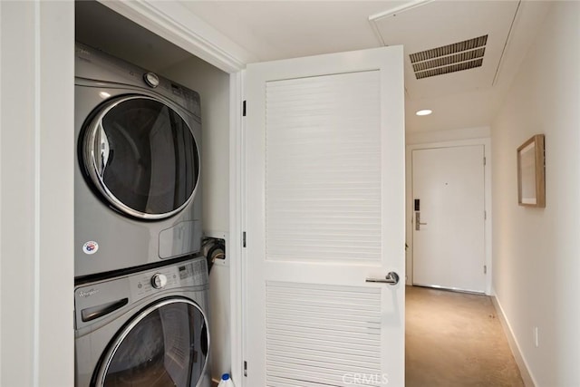 482 S Arroyo Pkwy Unit 408, Pasadena, CA 91105 - washroom with stacked washing machine and dryer, carpet flooring, baseboards, attic access, and recessed lighting