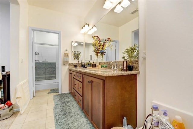 12474 Benton Dr Unit 2, Rancho Cucamonga, CA 91739 - full bathroom featuring a shower stall, double vanity, and tile patterned flooring
