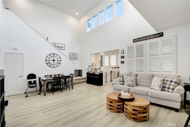 12474 Benton Dr Unit 2, Rancho Cucamonga, CA 91739 - living area with a towering ceiling and wood finished floors