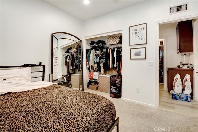 12474 Benton Dr Unit 2, Rancho Cucamonga, CA 91739 - carpeted bedroom with stacked washing machine and dryer and baseboards