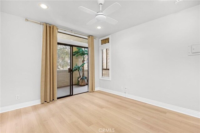 spare room featuring light wood-style floors, baseboards, recessed lighting, and a ceiling fan