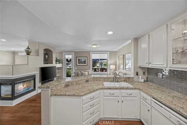 1008 N Turner Ave Unit 260, Ontario, CA 91764 - kitchen featuring open floor plan, white dishwasher, a sink, a peninsula, and white cabinets