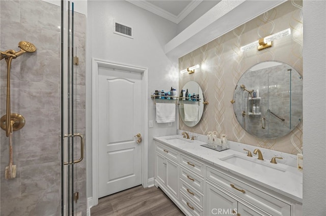 1008 N Turner Ave Unit 260, Ontario, CA 91764 - bathroom with crown molding, double vanity, a shower stall, and wood finished floors