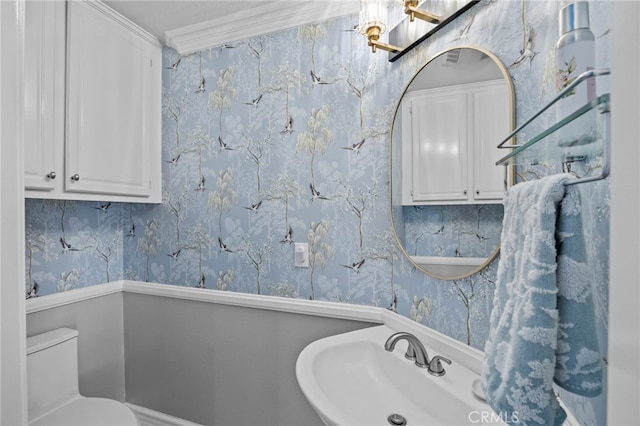 1008 N Turner Ave Unit 260, Ontario, CA 91764 - half bathroom featuring wallpapered walls, toilet, crown molding, and a sink