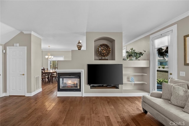 1008 N Turner Ave Unit 260, Ontario, CA 91764 - living area with wood finished floors, healthy amount of natural light, a chandelier, and crown molding