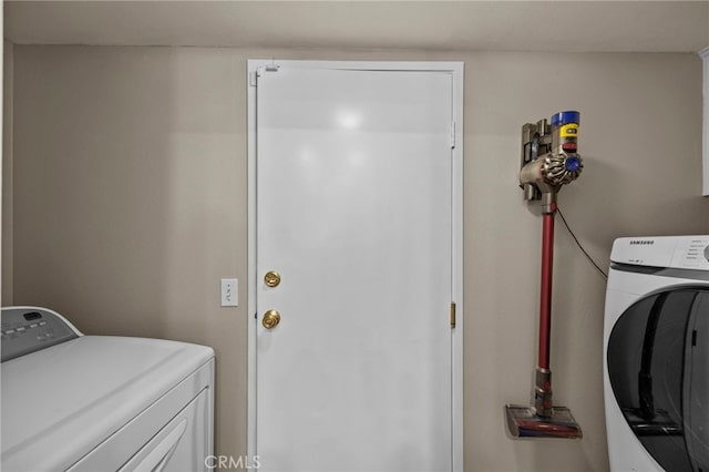 laundry area with separate washer and dryer