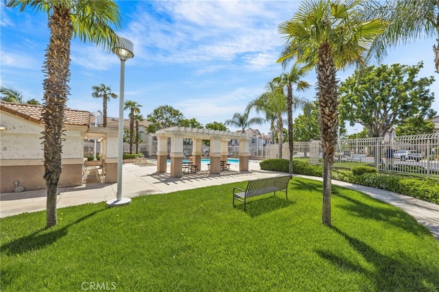 view of home's community with a pool and a patio area