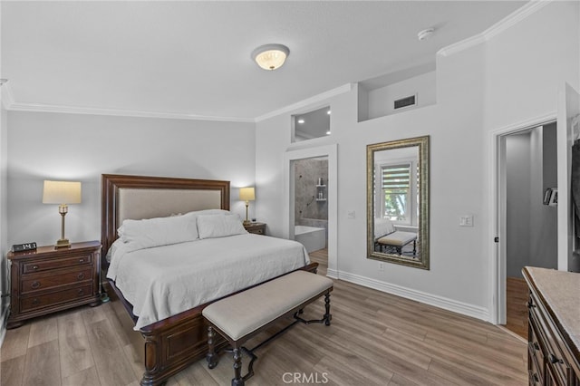 bedroom featuring crown molding, light wood-style floors, and baseboards