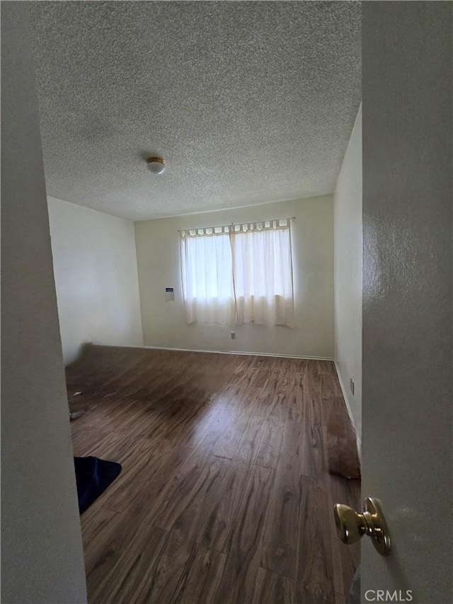 13436 Francisquito Ave Unit C, Baldwin Park, CA 91706 - spare room with a textured ceiling and wood finished floors