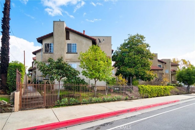 612 San Gabriel Blvd, Rosemead, CA 91770 - view of property exterior featuring a fenced front yard, stucco siding, and a chimney