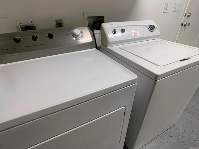 laundry area with independent washer and dryer