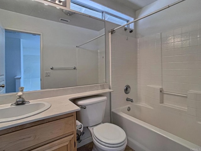 full bathroom with toilet, vanity, and washtub / shower combination