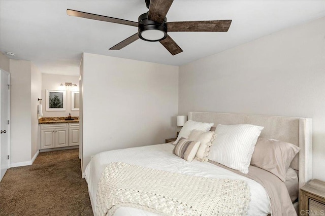 bedroom featuring carpet flooring, ensuite bath, baseboards, and a ceiling fan