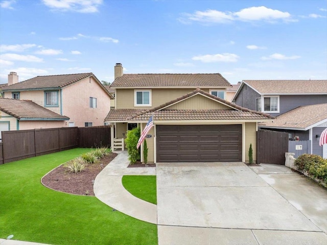 traditional-style home featuring a tile roof, an attached garage, concrete driveway, and a chimney
