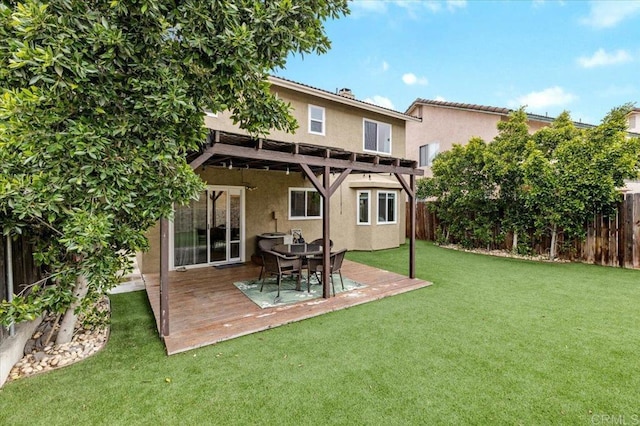 back of house featuring stucco siding and a pergola