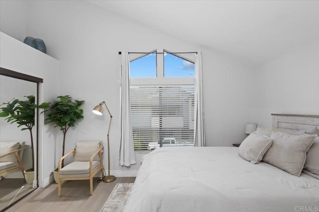 2135 E Valley Pkwy Unit 51, Escondido, CA 92027 - bedroom featuring wood finished floors and vaulted ceiling