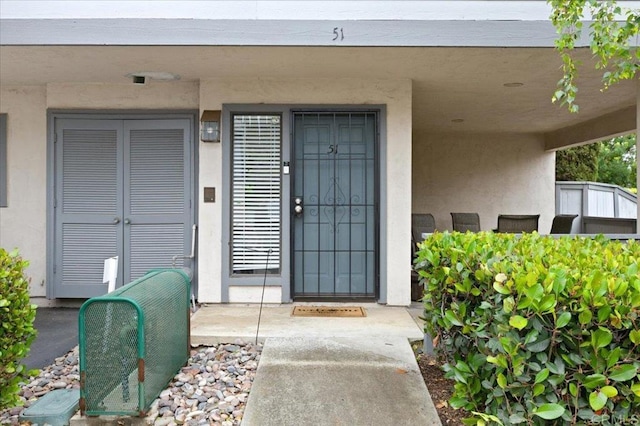 2135 E Valley Pkwy Unit 51, Escondido, CA 92027 - view of exterior entry featuring stucco siding