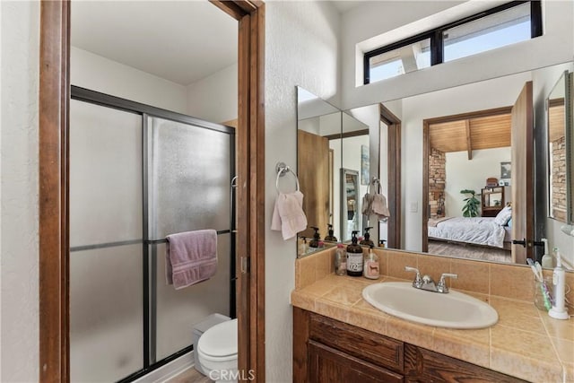 bathroom featuring ensuite bath, a stall shower, toilet, and vanity