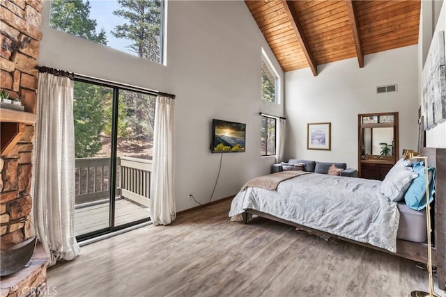 bedroom featuring high vaulted ceiling, wooden ceiling, access to exterior, wood finished floors, and beamed ceiling