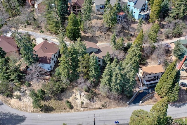 aerial view of property and surrounding area with nearby suburban area