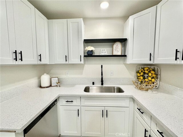 kitchen featuring dishwasher, a sink, open shelves, white cabinets, and recessed lighting