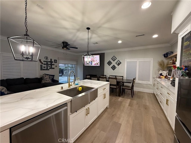 23 Ponte Sonata, Lake Elsinore, CA 92532 - kitchen with dishwasher, a sink, a chandelier, light stone counters, and white cabinetry
