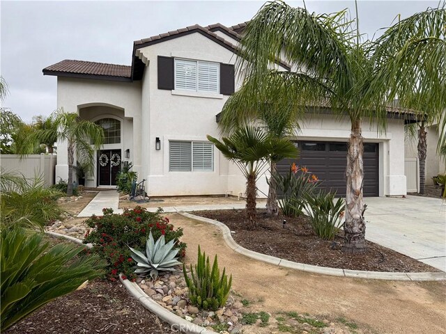 23 Ponte Sonata, Lake Elsinore, CA 92532 - view of front of home with stucco siding, concrete driveway, a garage, fence, and a tile roof