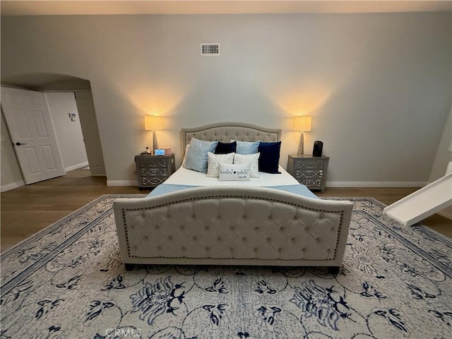 23 Ponte Sonata, Lake Elsinore, CA 92532 - bedroom featuring wood finished floors, baseboards, and arched walkways
