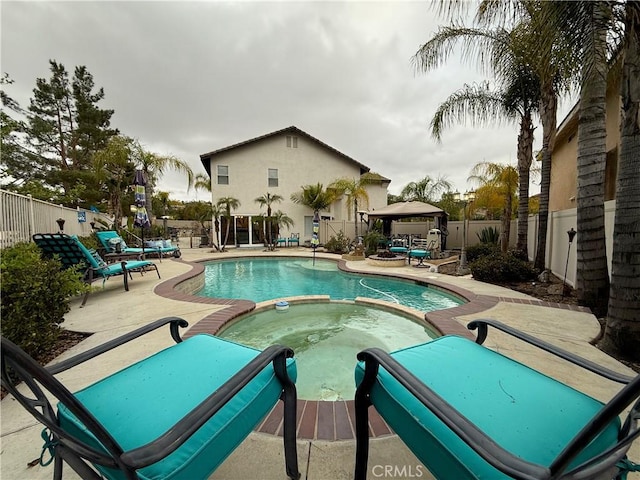 23 Ponte Sonata, Lake Elsinore, CA 92532 - view of pool featuring a gazebo, a pool with connected hot tub, a fenced backyard, and a patio