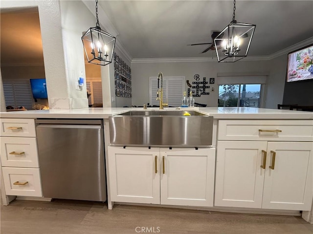23 Ponte Sonata, Lake Elsinore, CA 92532 - kitchen featuring a chandelier, stainless steel dishwasher, a sink, ornamental molding, and white cabinetry