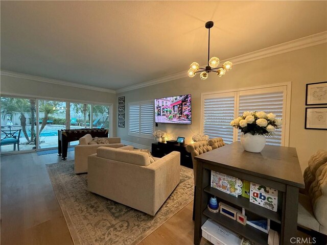 23 Ponte Sonata, Lake Elsinore, CA 92532 - living room with a chandelier, crown molding, and wood finished floors