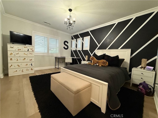 23 Ponte Sonata, Lake Elsinore, CA 92532 - bedroom featuring ornamental molding, a chandelier, baseboards, and wood finished floors