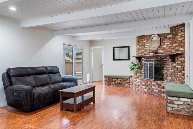 4864 Hersholt Ave, Long Beach, CA 90808 - living area featuring wood finished floors, a fireplace, beamed ceiling, wooden ceiling, and recessed lighting