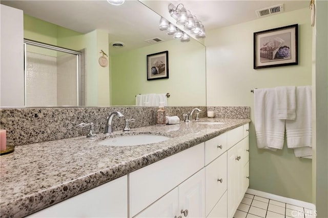 4864 Hersholt Ave, Long Beach, CA 90808 - full bathroom with tile patterned floors, a stall shower, double vanity, and baseboards
