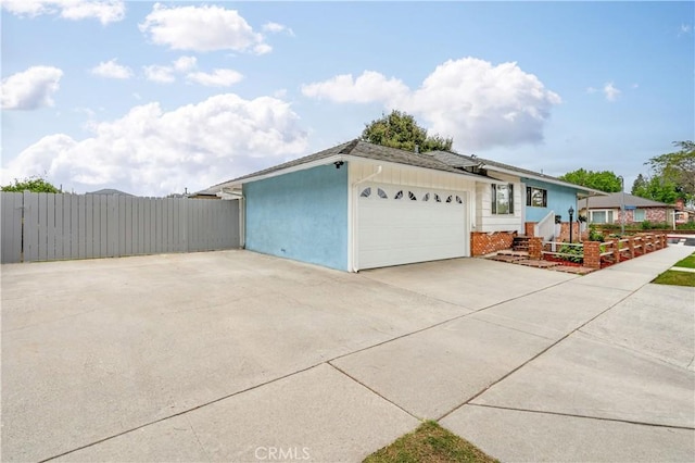 4864 Hersholt Ave, Long Beach, CA 90808 - garage featuring fence and concrete driveway