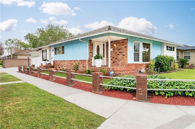 4864 Hersholt Ave, Long Beach, CA 90808 - view of front facade featuring an attached garage, brick siding, and stucco siding
