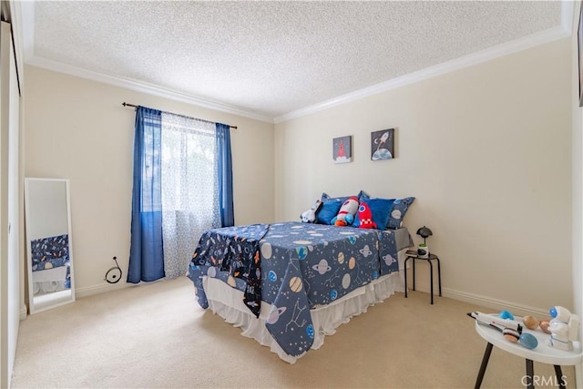 carpeted bedroom with ornamental molding, a textured ceiling, and baseboards