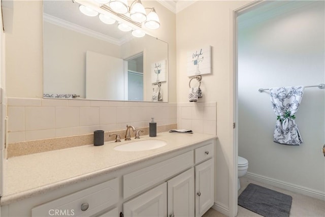 bathroom with crown molding, vanity, and toilet