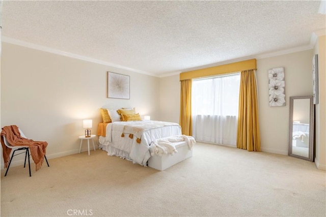 carpeted bedroom with ornamental molding, a textured ceiling, and baseboards