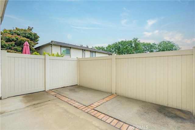 view of patio / terrace featuring fence