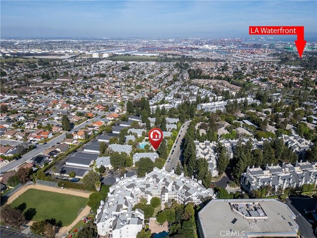 aerial view of property's location with nearby suburban area